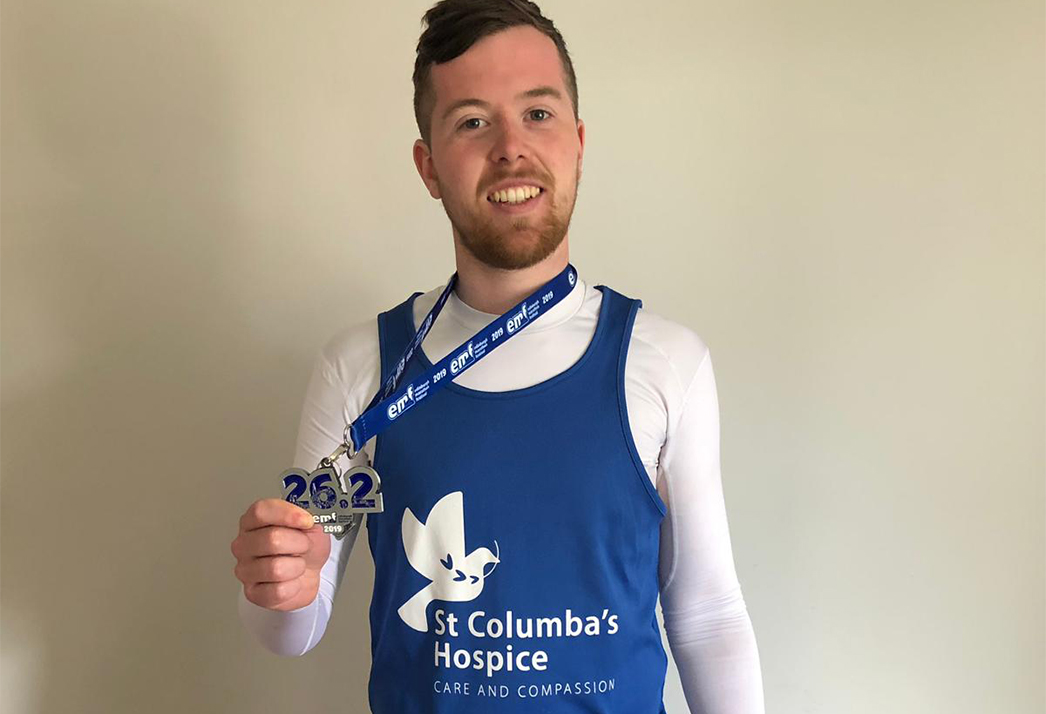 A runner with their medal from the Edinburgh Marathon Festival